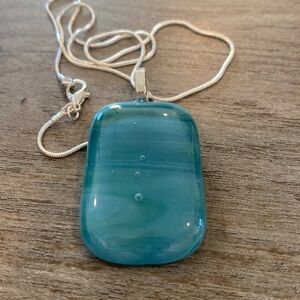 Delmarva Designs  green fused glass pendant on 18” silver plated chain